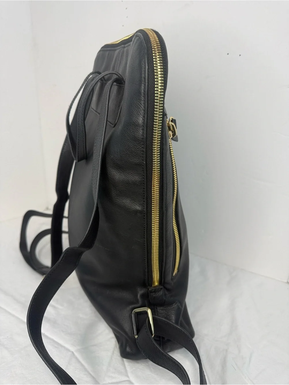 Black Leather Men’s Backpack with Gold Hardware